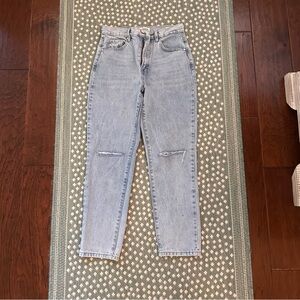 Light blue jeans with distressed detail